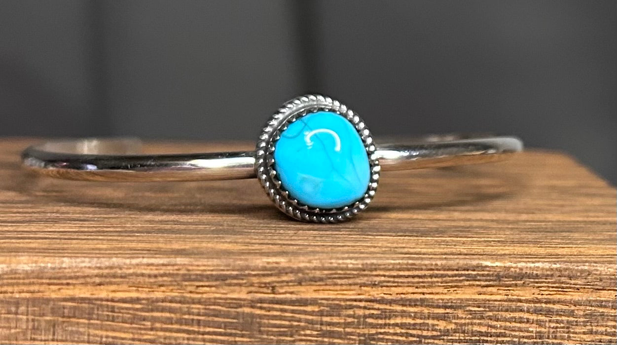 Navajo made turquoise cuff bracelet by Ella Cowboy