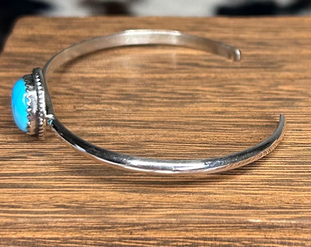 Navajo made turquoise cuff bracelet by Ella Cowboy