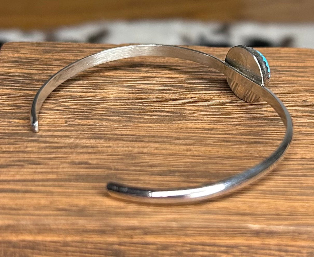Navajo made turquoise cuff bracelet by Ella Cowboy