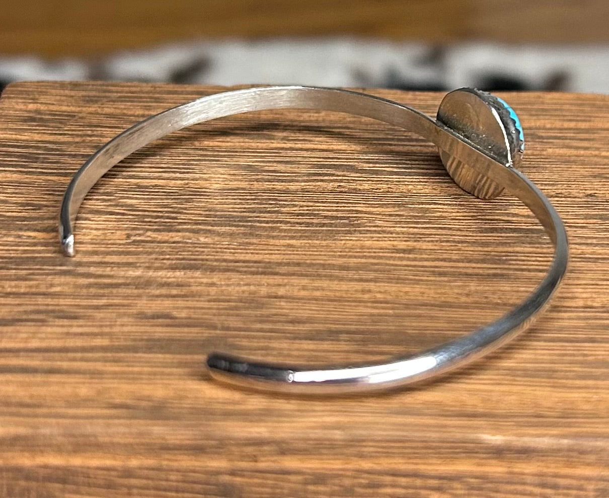 Navajo made turquoise cuff bracelet by Ella Cowboy